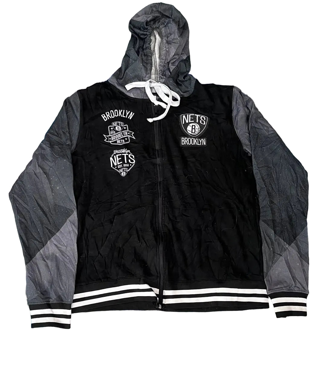 A black and gray zip-up hooded jacket with white drawstrings and white Brooklyn Nets graphics,