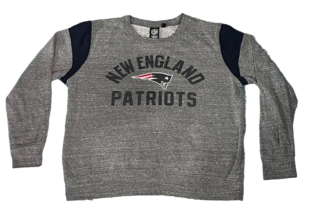 A heather gray long-sleeve crewneck sweatshirt with navy blue shoulder panels and 'NEW ENGLAND PATRIOTS' text with the team logo on the chest