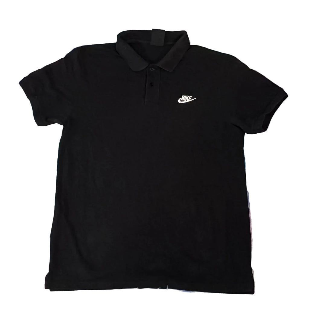 A black short-sleeve polo shirt with a small white Nike swoosh logo on the left chest, 
