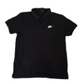A black short-sleeve polo shirt with a small white Nike swoosh logo on the left chest, 
