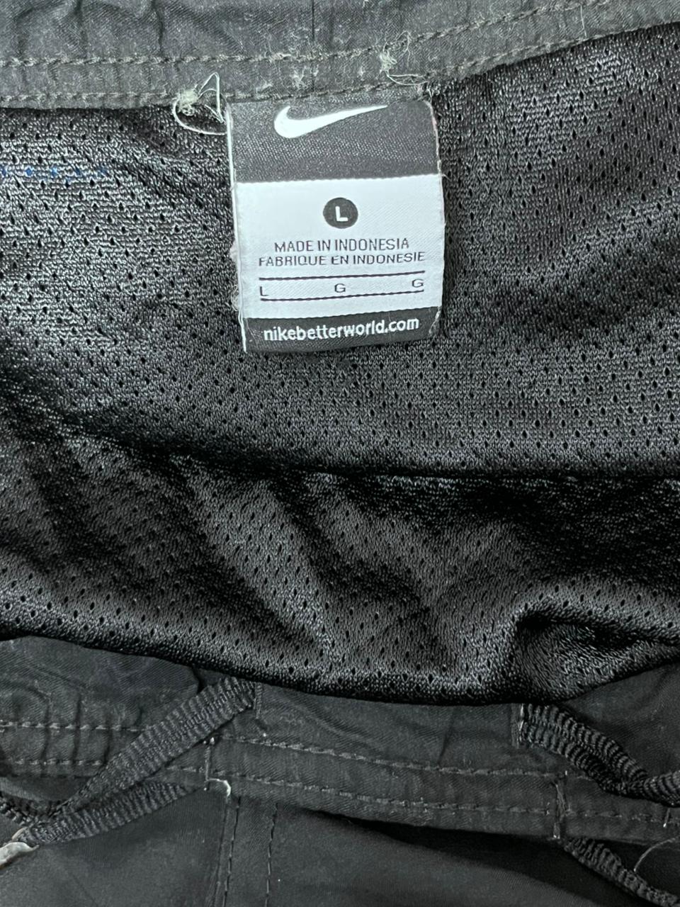 Close-up of a Nike tag on a piece of Black fabric.