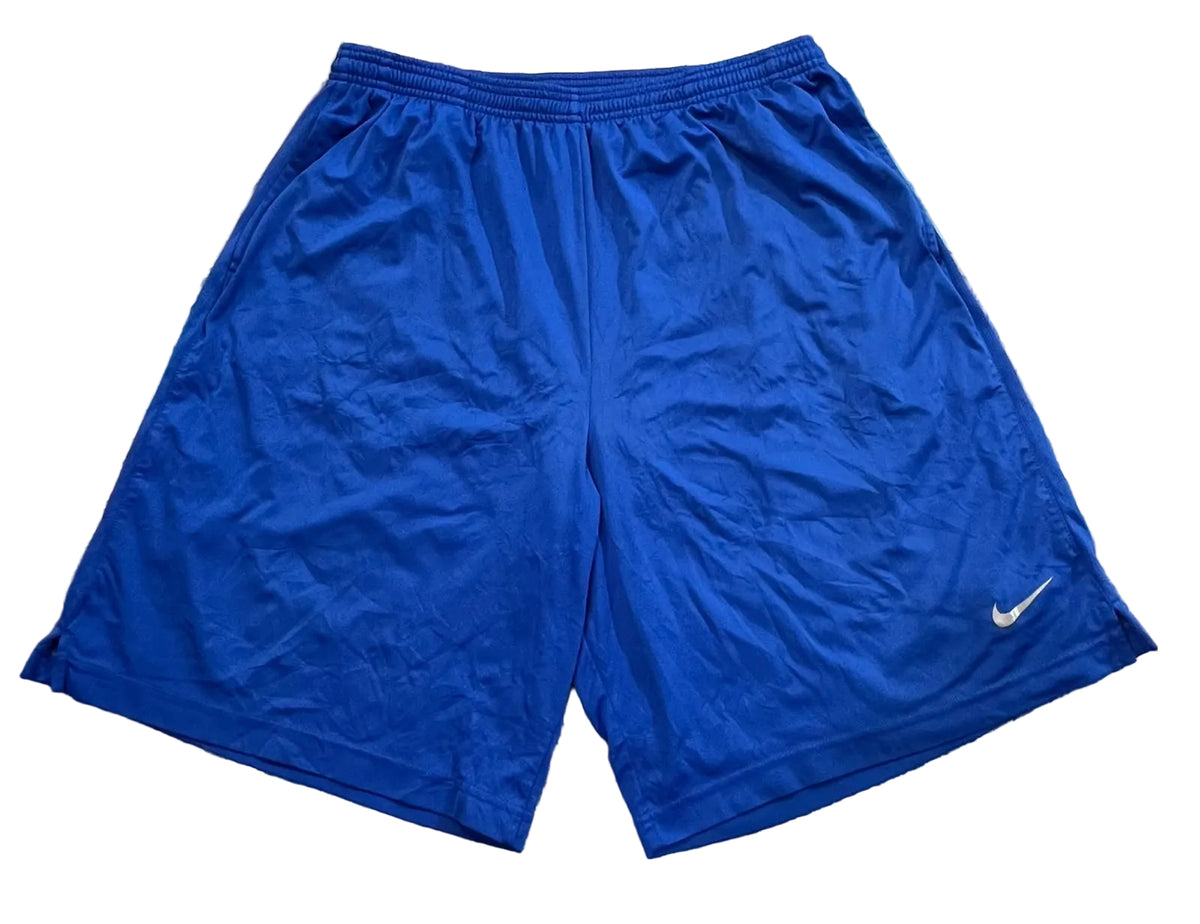Blue Nike athletic short. A small white Nike swoosh logo is visible on the lower left leg of the shorts.