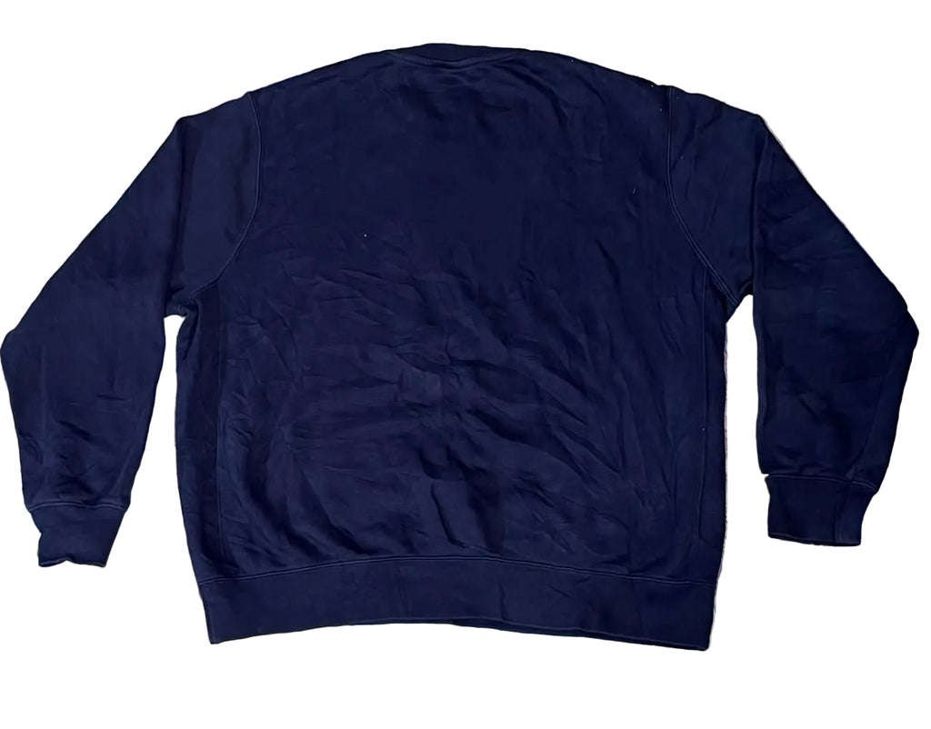 A dark navy blue sweatshirt faux fur blanket with blue, pink, and purple tones.A