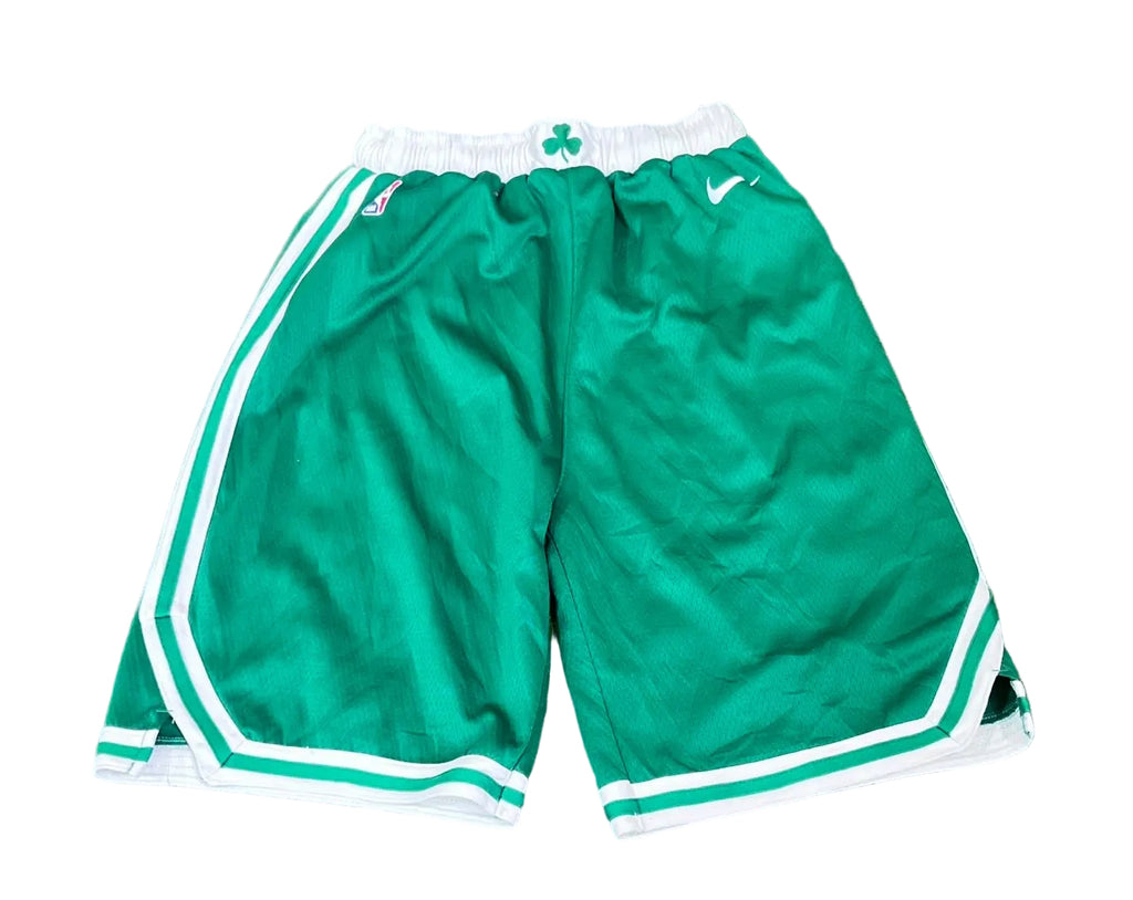 Green Boston Celtics athletic shorts with white stripes, a white elastic waistband with a green shamrock, and a white Nike swoosh, 