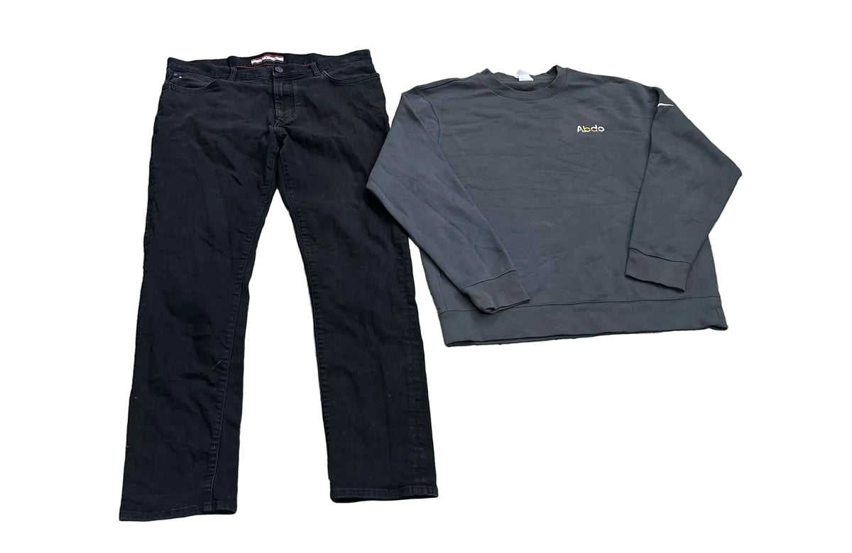 A pair of black slim-fit jeans and a dark gray long-sleeve crewneck sweatshirt with a small gold 'Kith' logo on the chest,