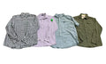 Four men's long-sleeve button-down shirts a black and white gingham check shirt, a light lavender button-down with a small green tag, a light blue and white gingham shirt, and an olive green button-down with chest pockets.