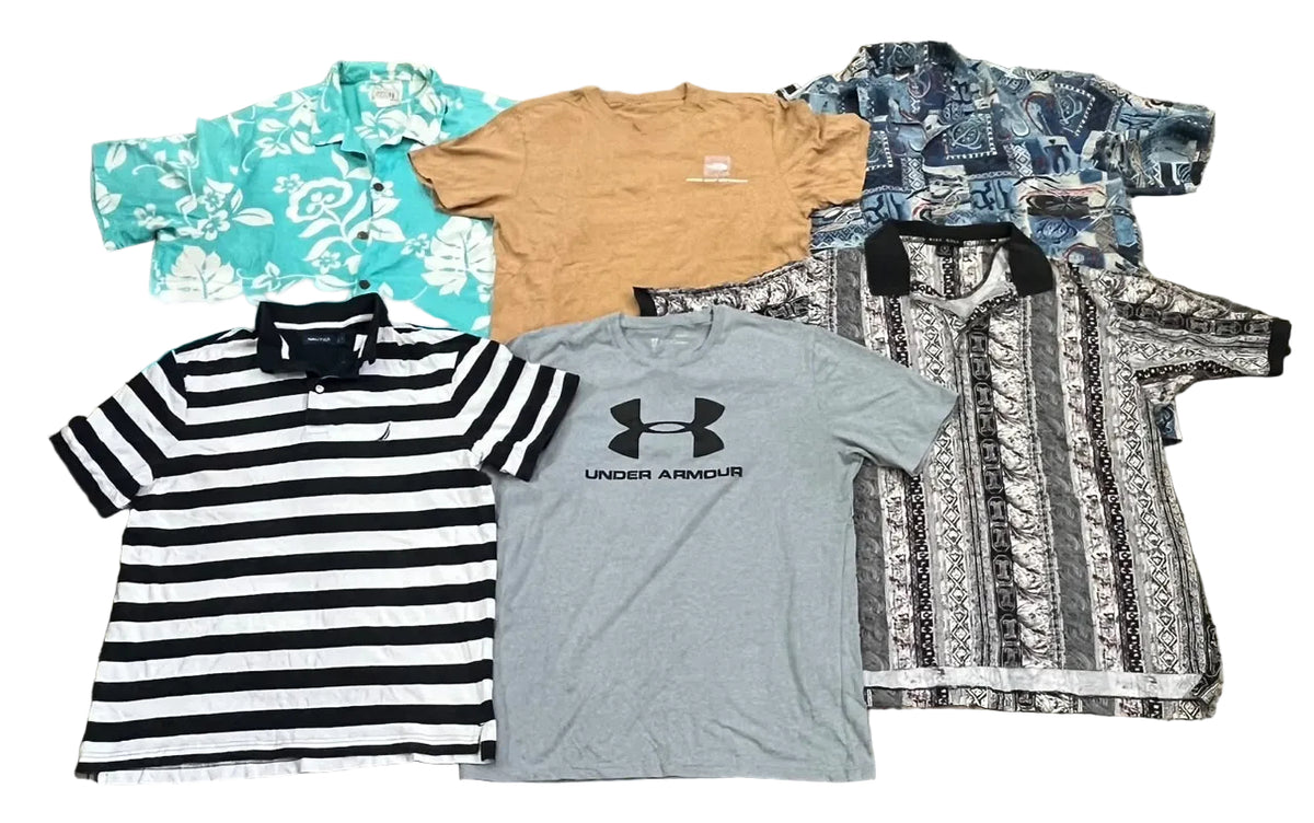 Six different short-sleeve t-shirts and button-up shirts. The collection includes a turquoise floral shirt, a tan crewneck, a blue patterned shirt, a black-and-white striped polo, a gray Under Armour t-shirt, and a black-and-white patterned shirt.