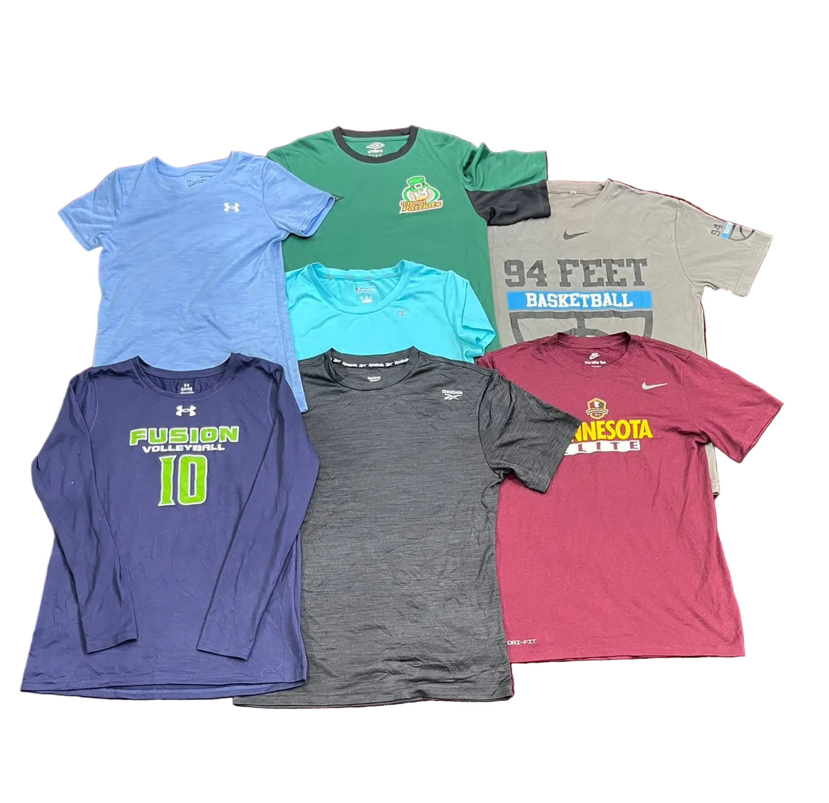 A collection of seven athletic t-shirts and a long-sleeve shirt The shirts include various colors like blue, green, gray, navy, and maroon, with different collegiate and sports team graphics.