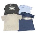 Four athletic shirtsa black long-sleeve graphic shirt reading 'McGinness Football Staff,' a light blue polo with a small Nike swoosh, a heather gray short-sleeve polo, and a navy polo with thin multicolor stripes across the chest and an Adidas logo.