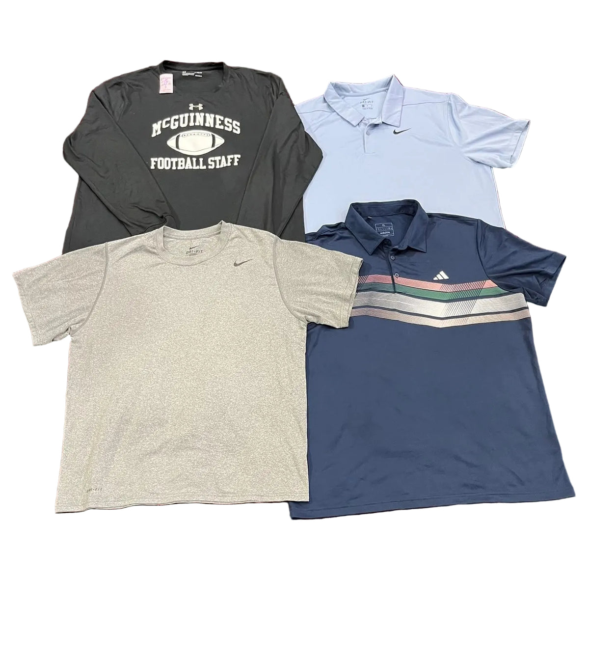 Four athletic shirtsa black long-sleeve graphic shirt reading 'McGinness Football Staff,' a light blue polo with a small Nike swoosh, a heather gray short-sleeve polo, and a navy polo with thin multicolor stripes across the chest and an Adidas logo.