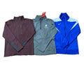 Three athletic quarter-zip jackets: a burgundy one on the left, a gray one in the center with a visible Puma logo, and a bright blue one on the right with a white Nike swoosh.