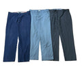 Three pairs of casual trousers: one dark navy blue, one muted light blue, and one charcoal gray.