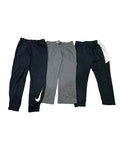 Three pairs of athletic sweatpants one black with a white Nike swoosh, one heather gray, and one black with a white side stripe.