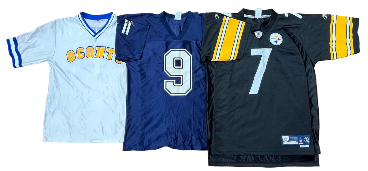 Three football jerseys a white jersey with blue trim and yellow 'O'CONTO' lettering on the left, a royal blue jersey with a large white number 9 in the center, and a black Pittsburgh Steelers jersey with yellow and white shoulder stripes and a large white number 7 on the right.