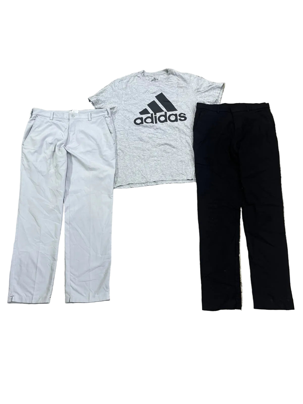 A light gray heathered Adidas t-shirt with a black logo, l all on a speckled terrazzo floor.