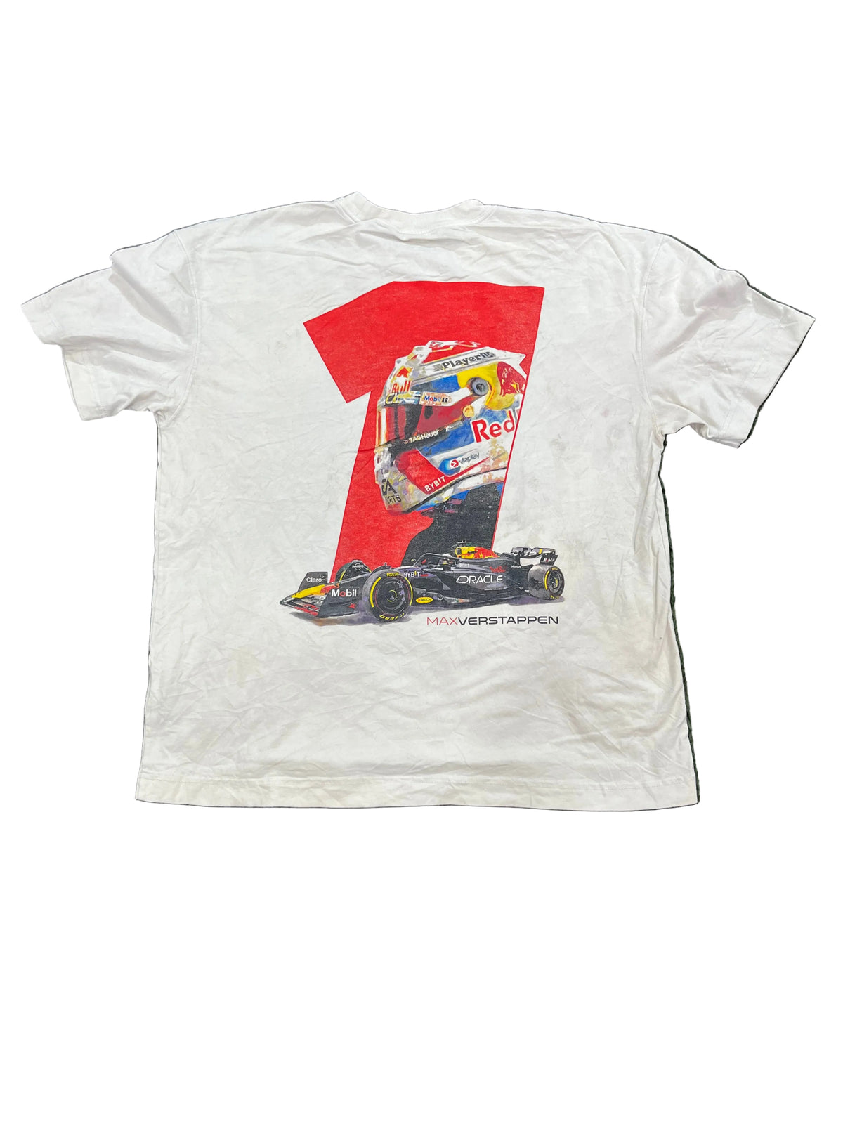 A white short-sleeve T-shirt
, featuring a large red number 1 graphic with a Formula 1 helmet and racing car print. Bare feet are visible at the bottom edge of the photo.