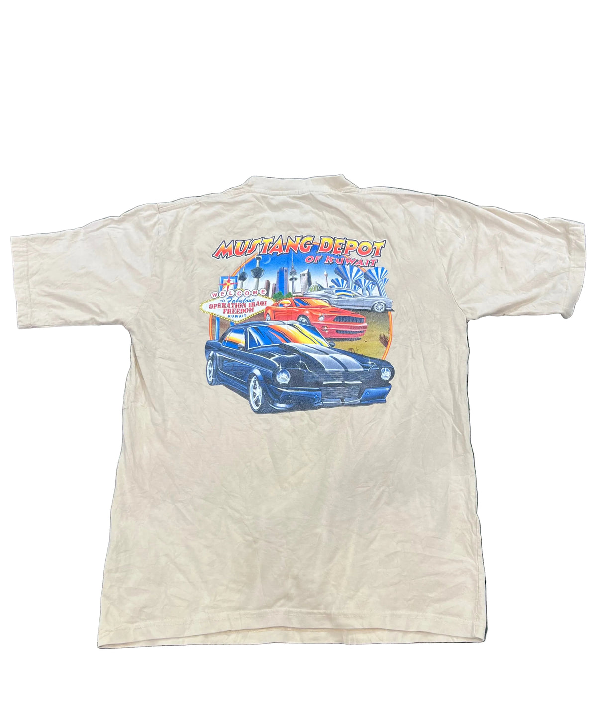 A cream-colored short-sleeve t-shirt, showing a large graphic print on the back featuring a blue Mustang car and the text 'Mustang Repost of Detroit'.