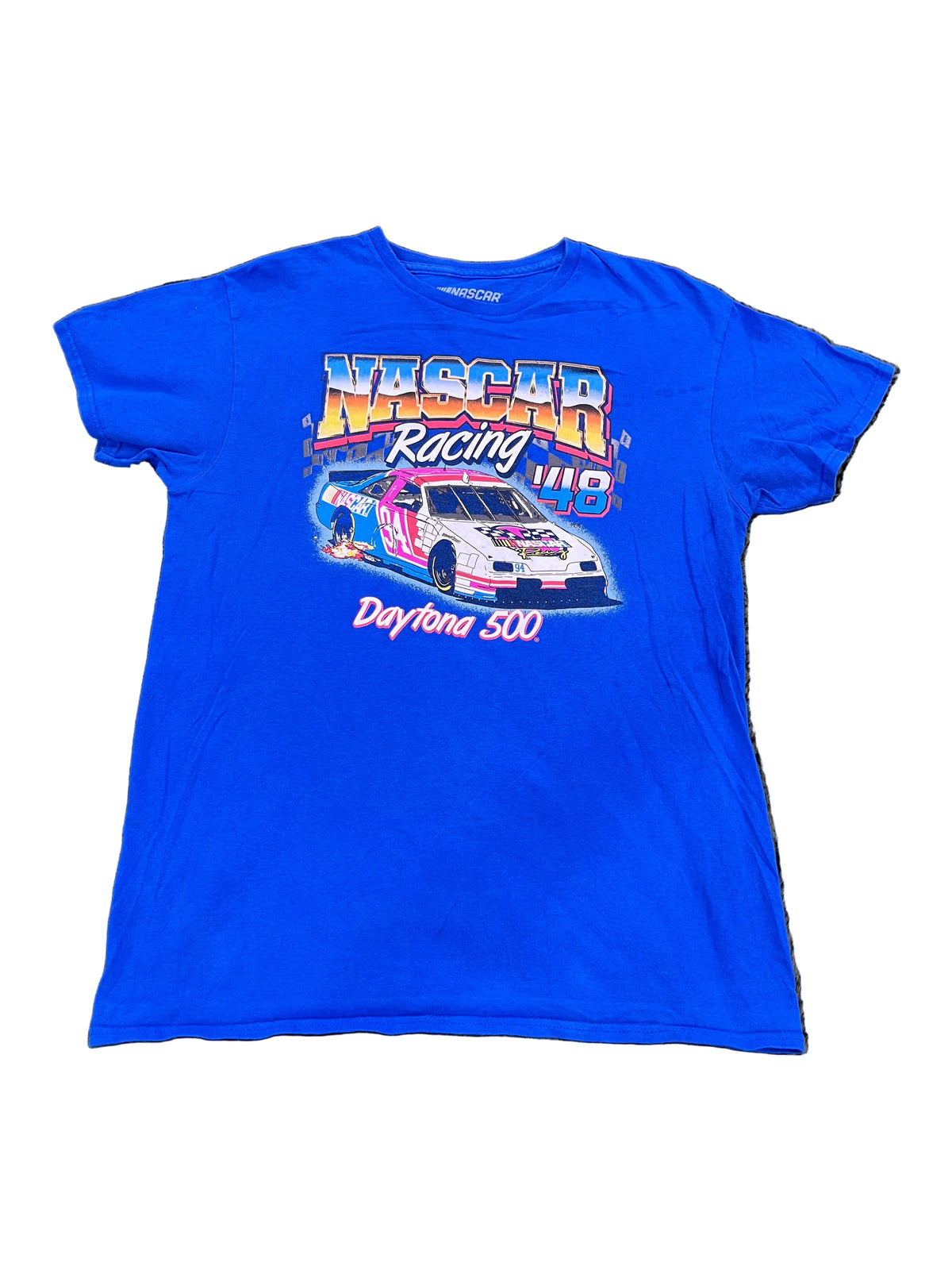 A bright blue short-sleeve t-shirt featuring a colorful NASCAR Racing Daytona 500 graphic,