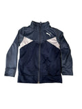A Puma full-zip track jacketThe jacket is navy blue with light beige panels on the shoulders and chest, and a white Puma logo on the left chest.