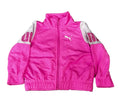 A bright pink Puma zip-up jacket with white sleeves, The jacket features a white Puma logo on the left chest and 'UNIDRAMA' text on the right sleeve.