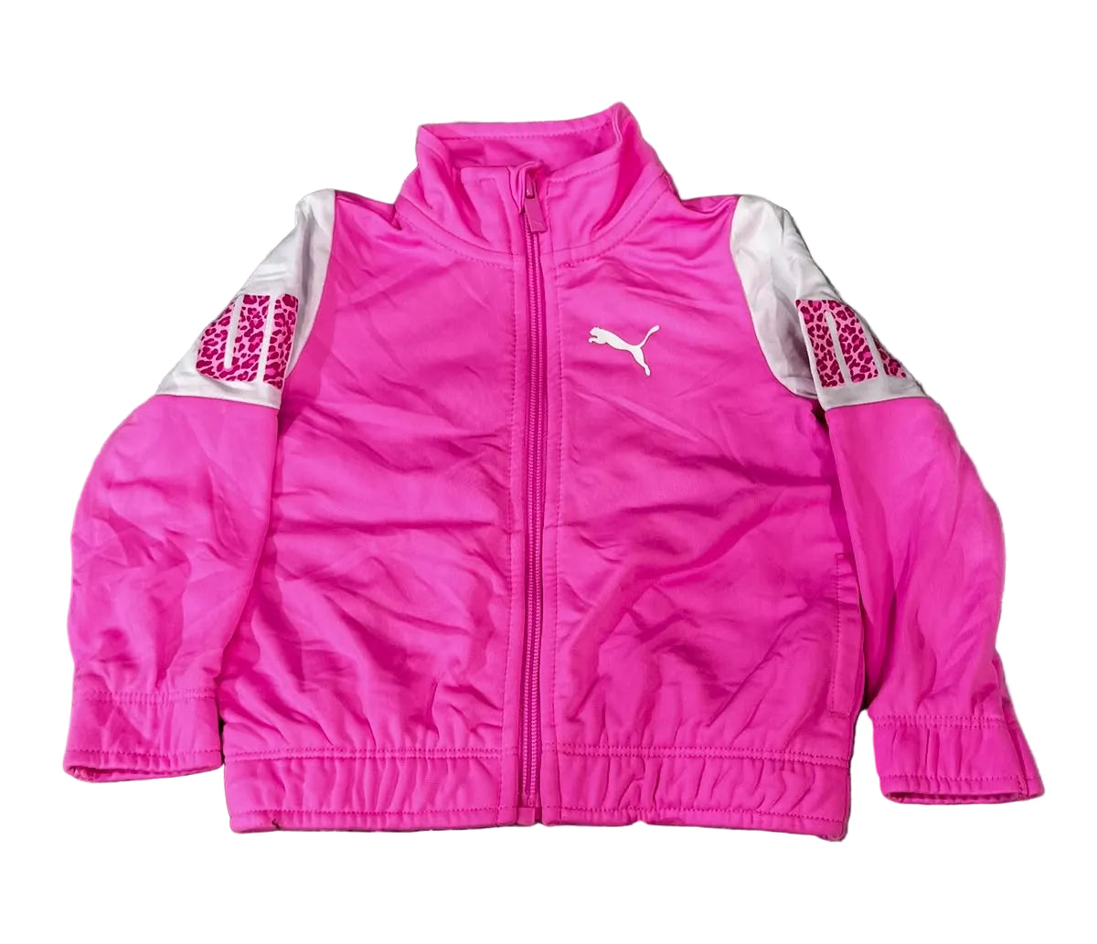 A bright pink Puma zip-up jacket with white sleeves, The jacket features a white Puma logo on the left chest and 'UNIDRAMA' text on the right sleeve.