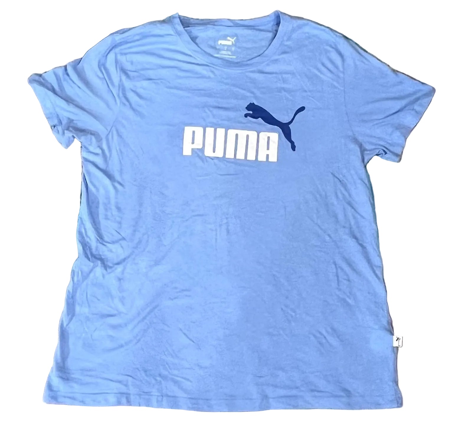 A light blue Puma short-sleeve t-shirt with a white 'PUMA' logo and dark blue leaping cat graphic on the chest