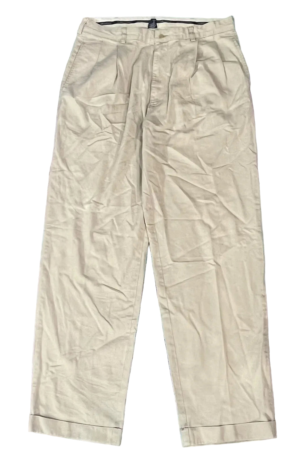 A pair of light beige pleated trousers 