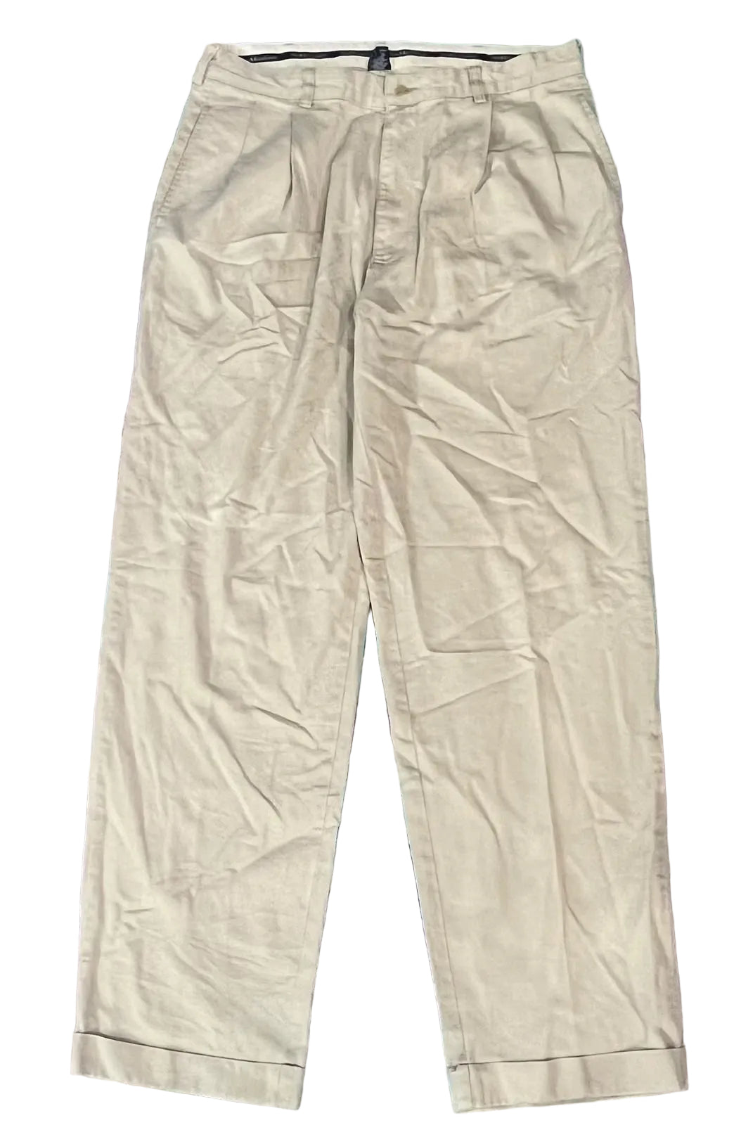 A pair of light beige pleated trousers 