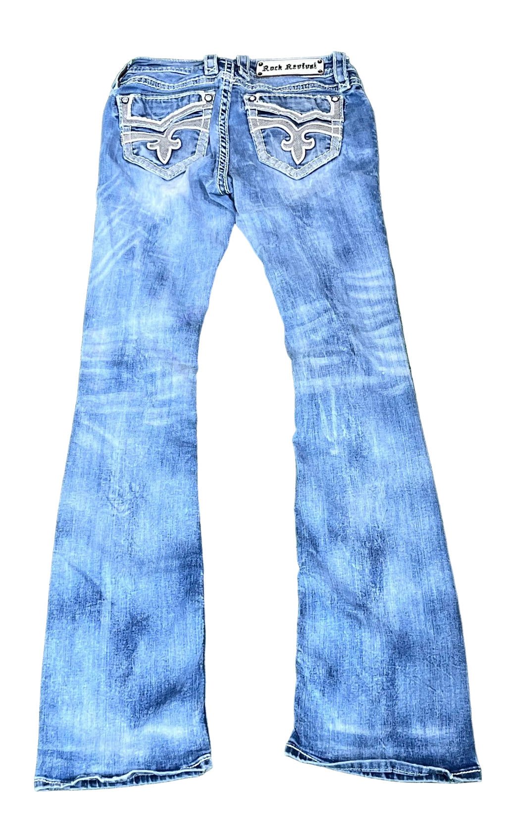 ROCK REVIVAL WOMEN JEANS ON A WHITE PLAIN BACKGROUND 