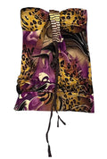A folded fashion scarf with a mixed print of leopard print, purple abstract waves, and black/white details, featuring a silver beaded top band and a long black tassel,