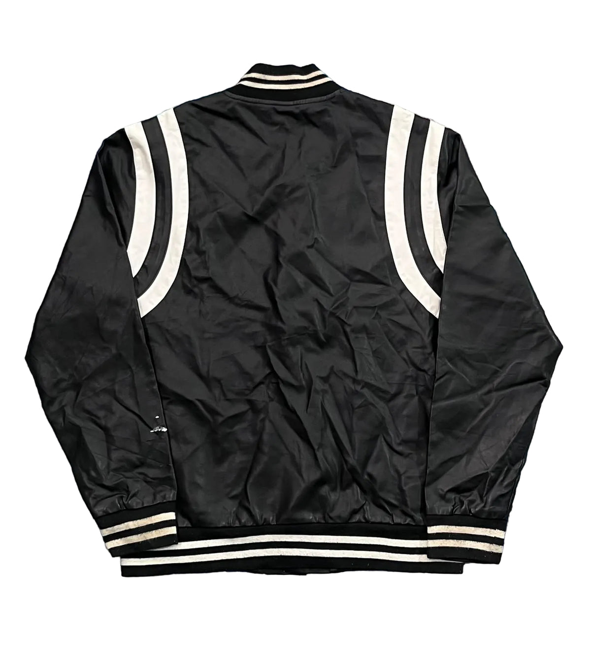 A black satin varsity-style jacket with white double stripes on the shoulders and ribbed collar, cuffs, and hem,