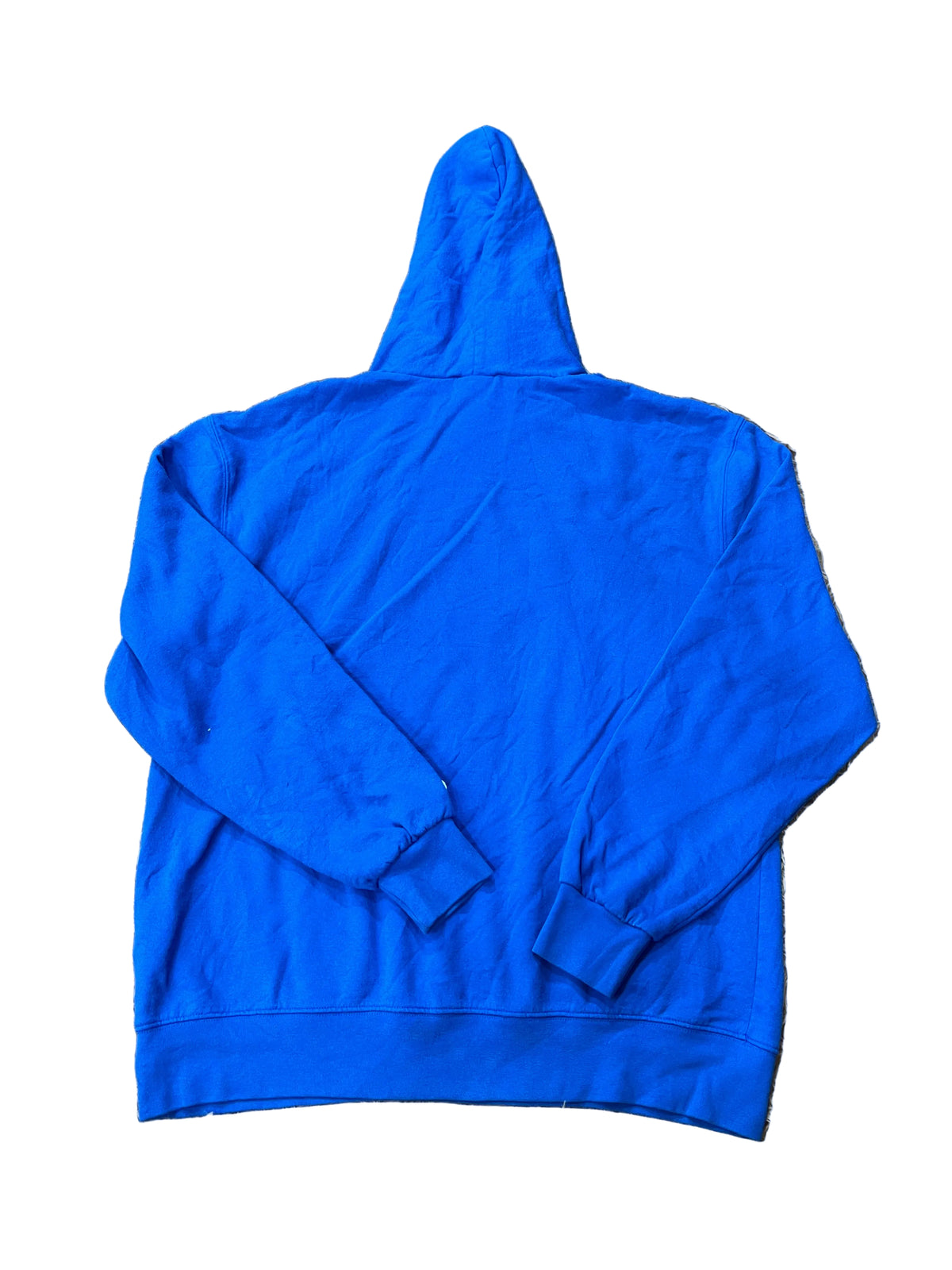 A bright royal blue hoodie with a hanger and patterned fabric visible in the upper right corner.