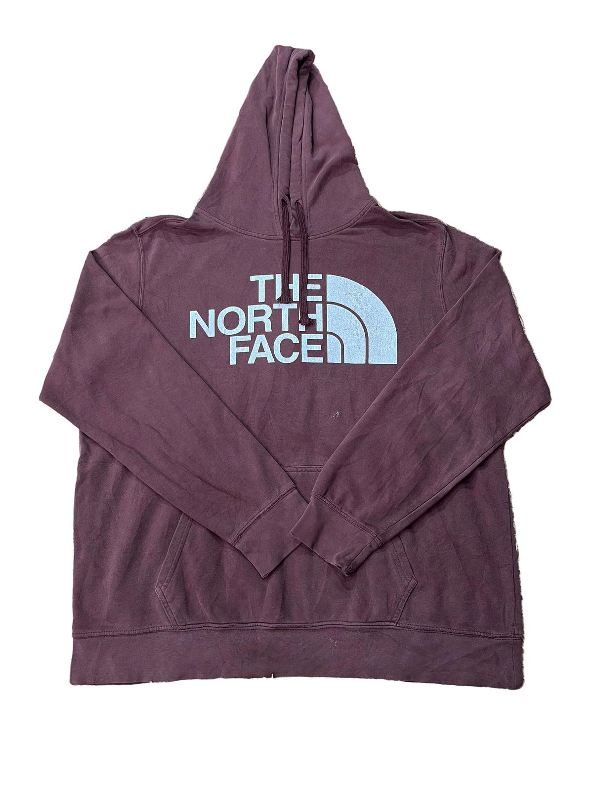 A maroon pullover hoodie with a white 'THE NORTH FACE' logo printed on the chest, 