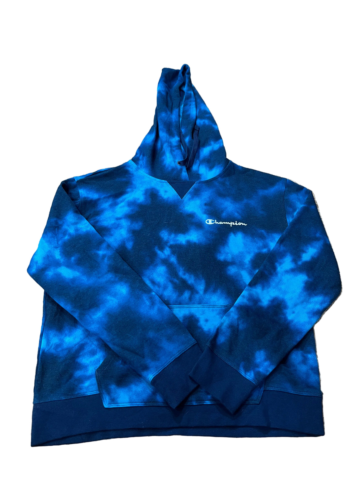 A blue and black tie-dye Champion hoodie is with hangers and other clothes visible in the background.
