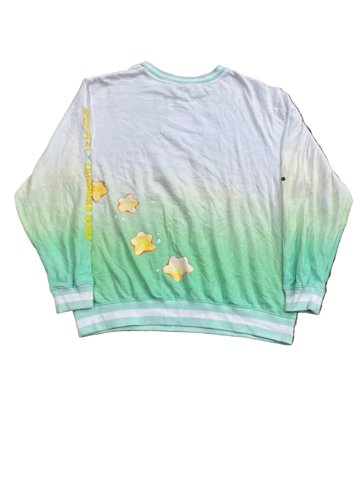 A short-sleeve t-shirt with a mint green and white gradient, featuring yellow star graphics and yellow text on the chest, 