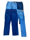 Three pairs of jeans in different blue washes showing the back pockets and waistbands.