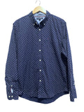 Tommy hilfiger navy blue shirt with white polka dots on a hanger against a white background