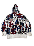A hooded sweatshirt with an all-over Texas Tech Red Raiders collegiate letter print, . The hoodie features a white base with navy blue and red varsity-style letters and numbers, with solid white ribbed cuffs and hem.