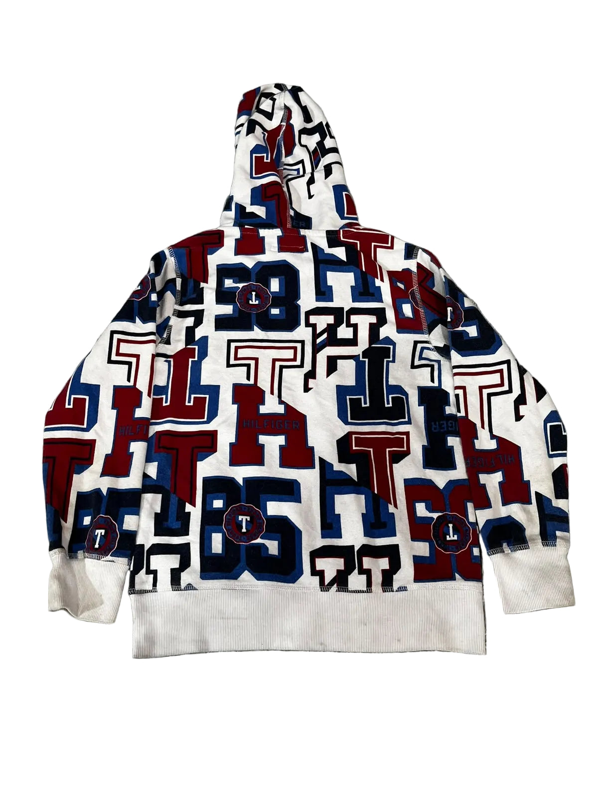 A white pullover hoodie with an all-over Texas Tech Red Raiders letter print in navy blue and red,