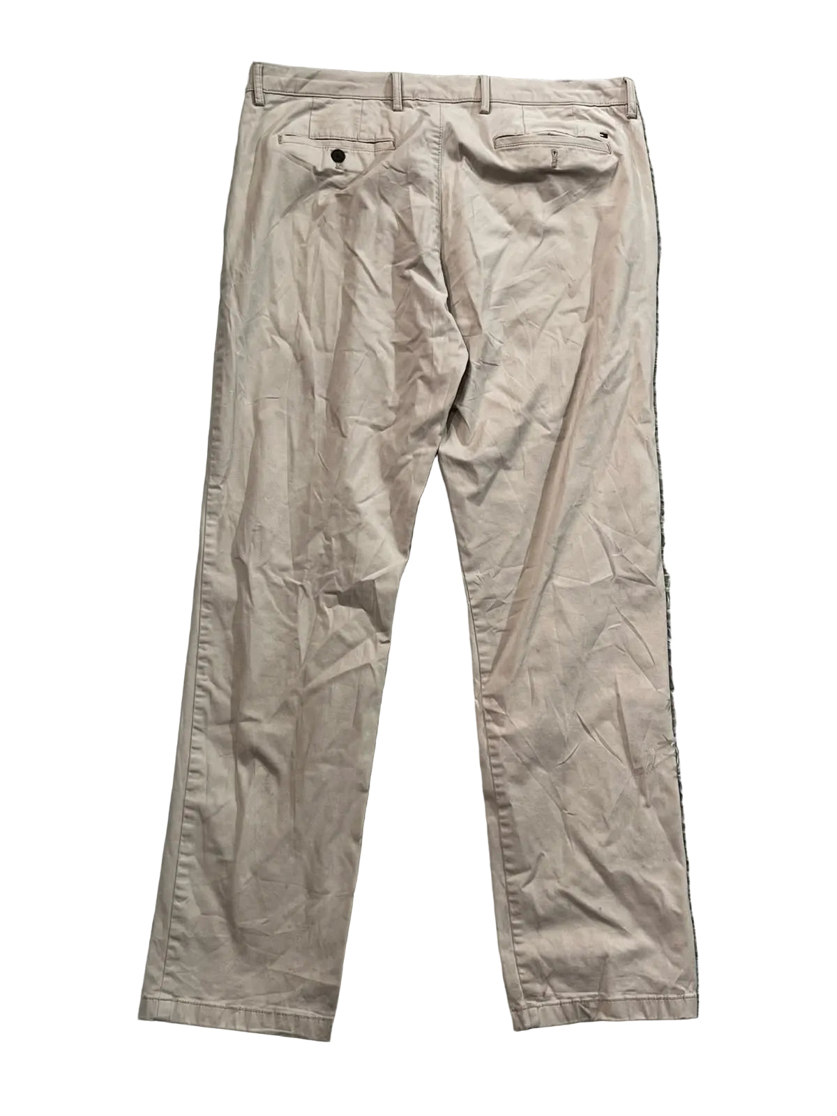 A pair of beige chino pants lshowing the back pockets and waistband.