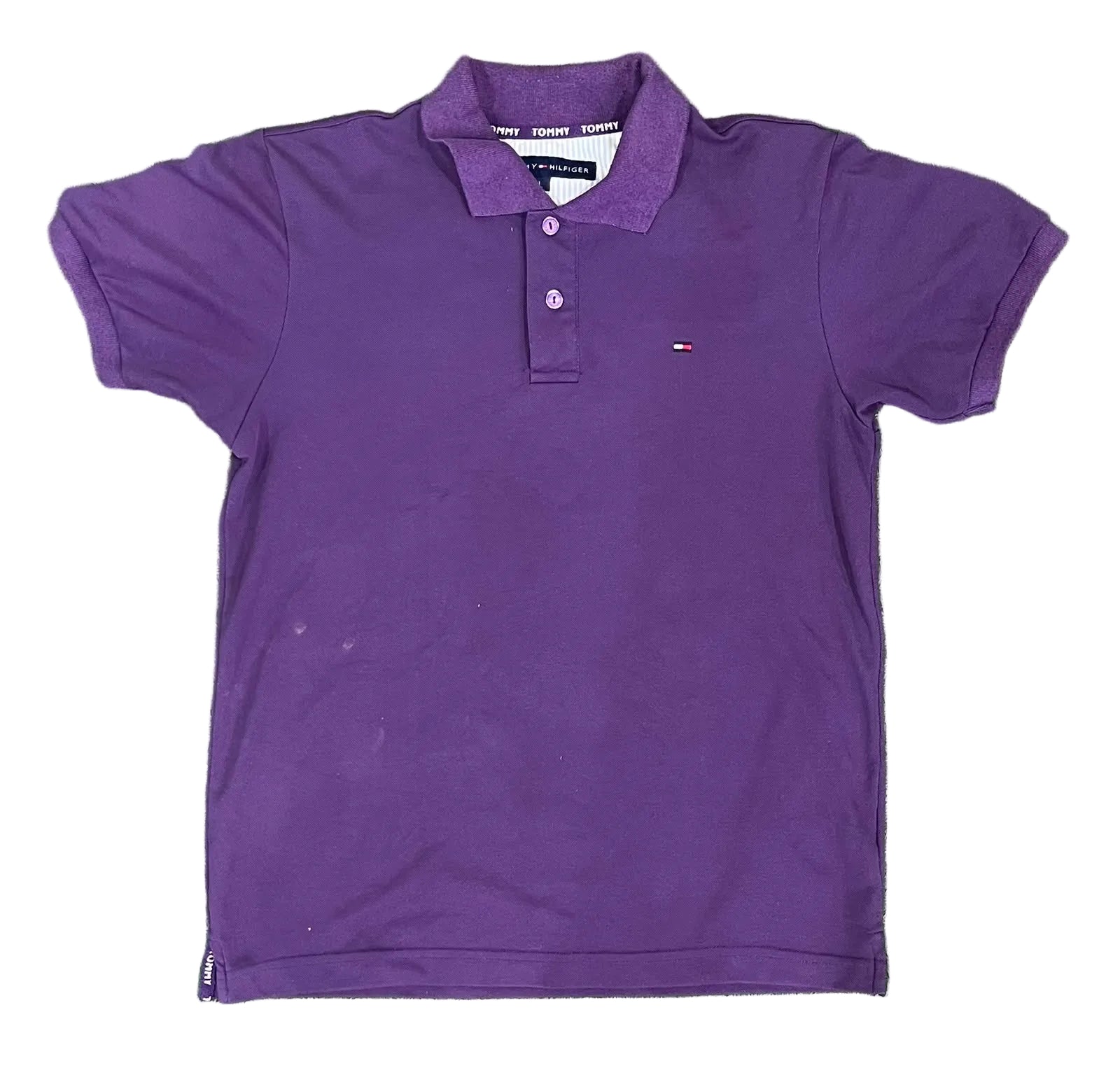 A purple short-sleeve polo shirt with a three-button placket and a small embroidered Tommy Hilfiger flag logo on the left chest, on a white plain background 