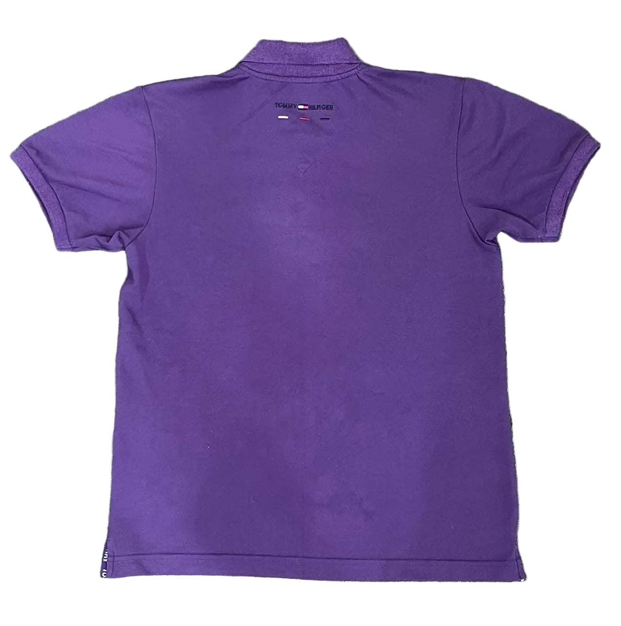A purple short-sleeve polo shirt  showing the back side with a small Tommy Hilfiger flag logo printed 
