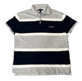 A short-sleeve striped polo shirt with horizontal bands of navy blue, light gray, and white, featuring a small white embroidered logo on the left chest. 