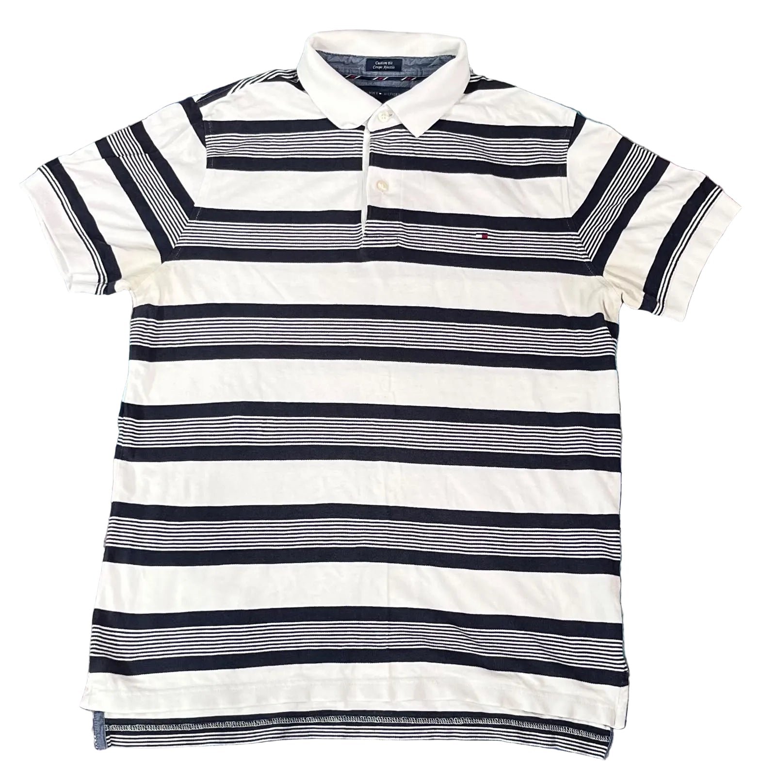 A Tommy Hilfiger striped polo shirt with horizontal navy, white, and gray stripes, 