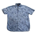 A short-sleeve button-up shirt with a blue and white paisley pattern,