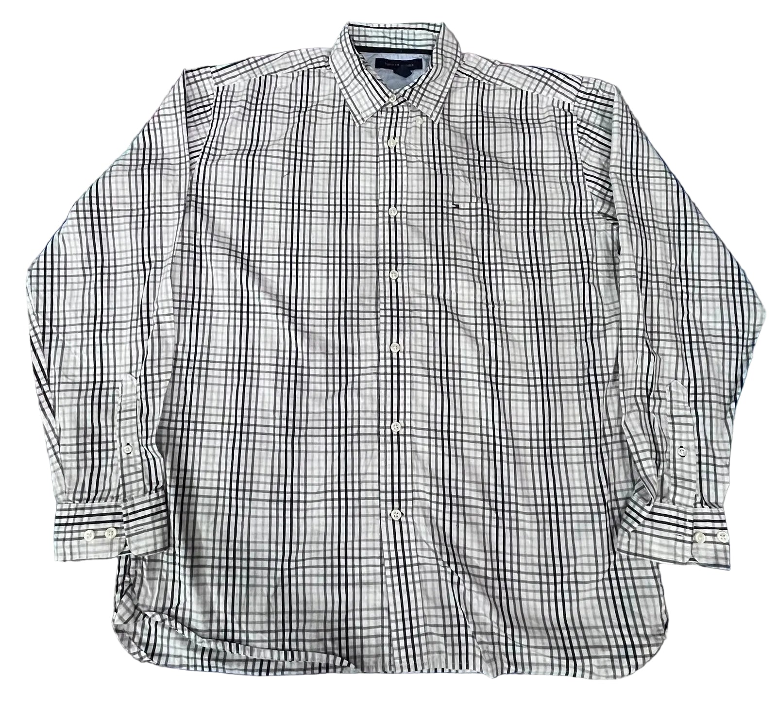 A long-sleeve button-up shirt with a black and white plaid pattern