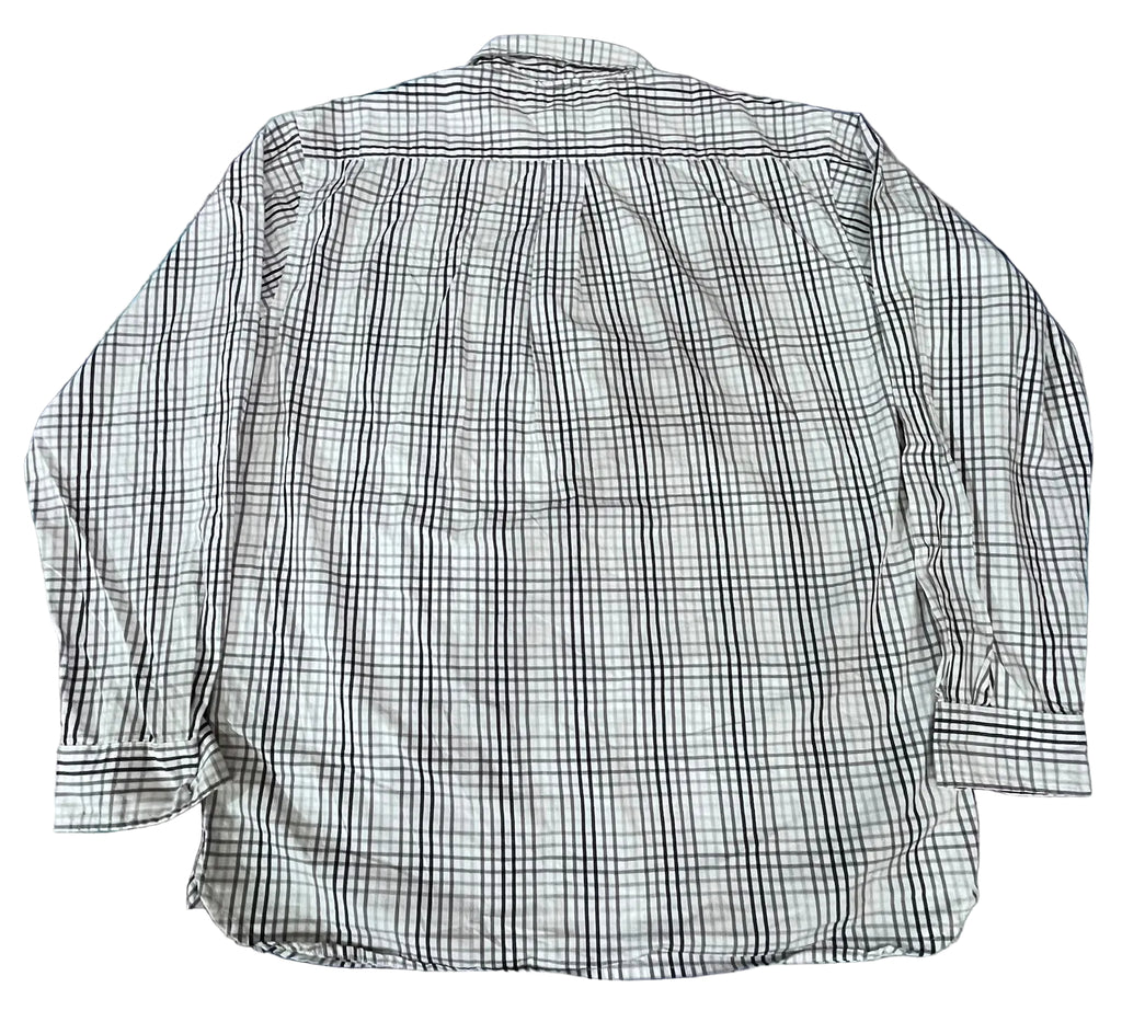 A long-sleeve plaid button-up shirt  The shirt features a white base with a black and gray plaid pattern.