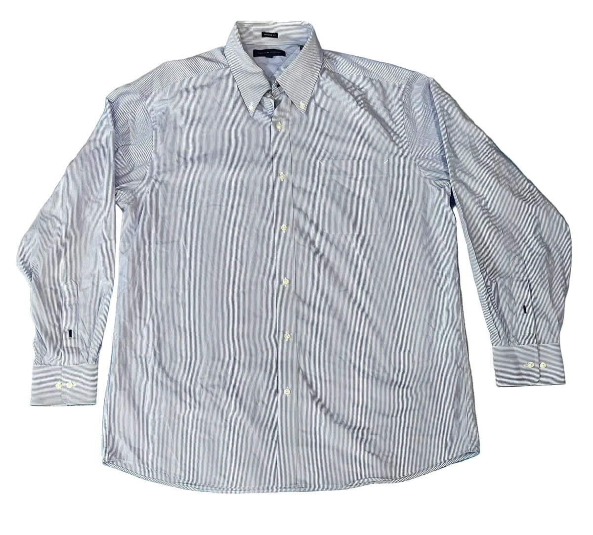 A light blue long-sleeve button-down shirt. The shirt has a pointed collar, a button-down front, and button cuffs.