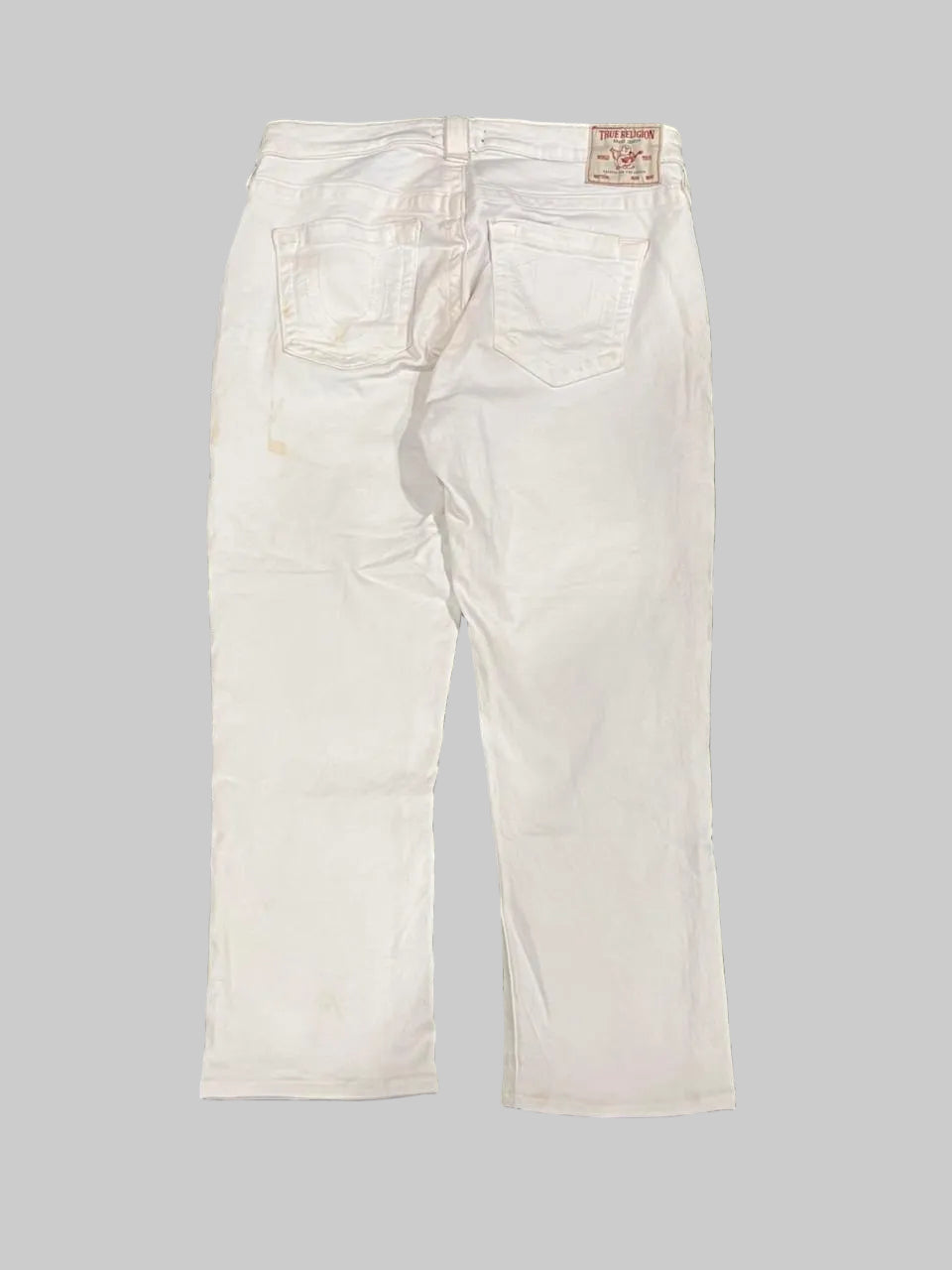 White jeans on a plain white background