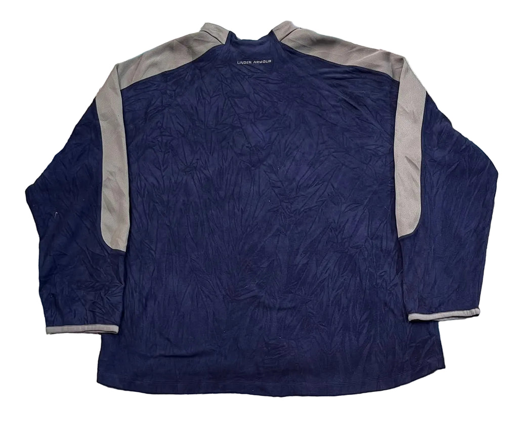 A navy blue long-sleeve athletic shirt with gray shoulder and sleeve panels, The brand name 'PINE RIDGE' is visible on the inner neck label.